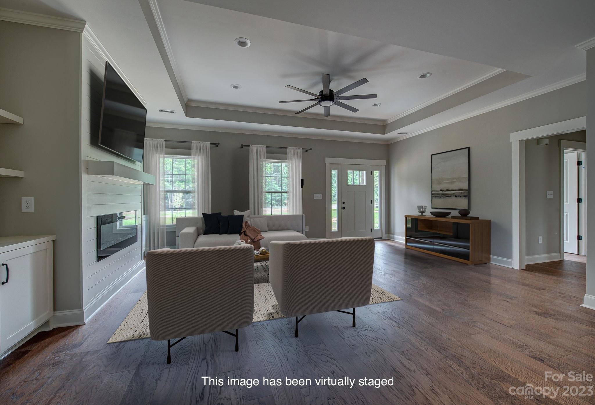 2911 Sparrow Springs Road Gastonia, NC 28052 - Photo 8 of 31 a living room with furniture a couch and a flat screen tv