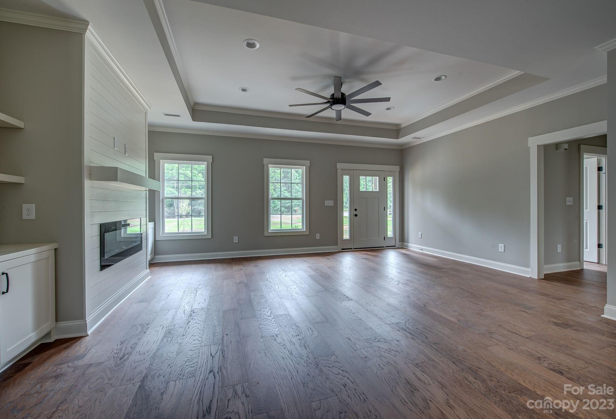 2911 Sparrow Springs Road Gastonia, NC 28052 - Photo 9 of 31 a view of livingroom and hallway with wooden floor