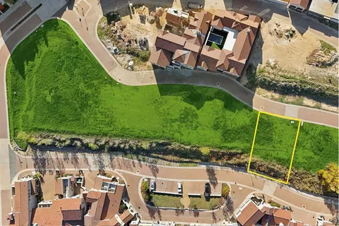 an aerial view of a house with a garden and swimming pool