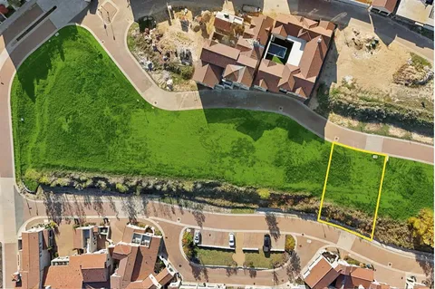 an aerial view of a house with a garden and swimming pool