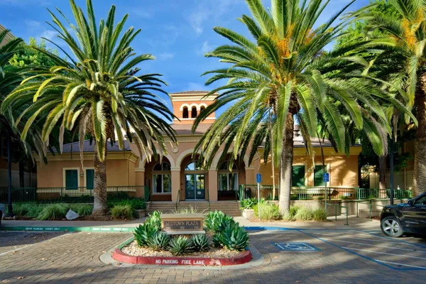 a front view of multiple houses with yard