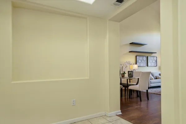 a view of a room with table and chairs