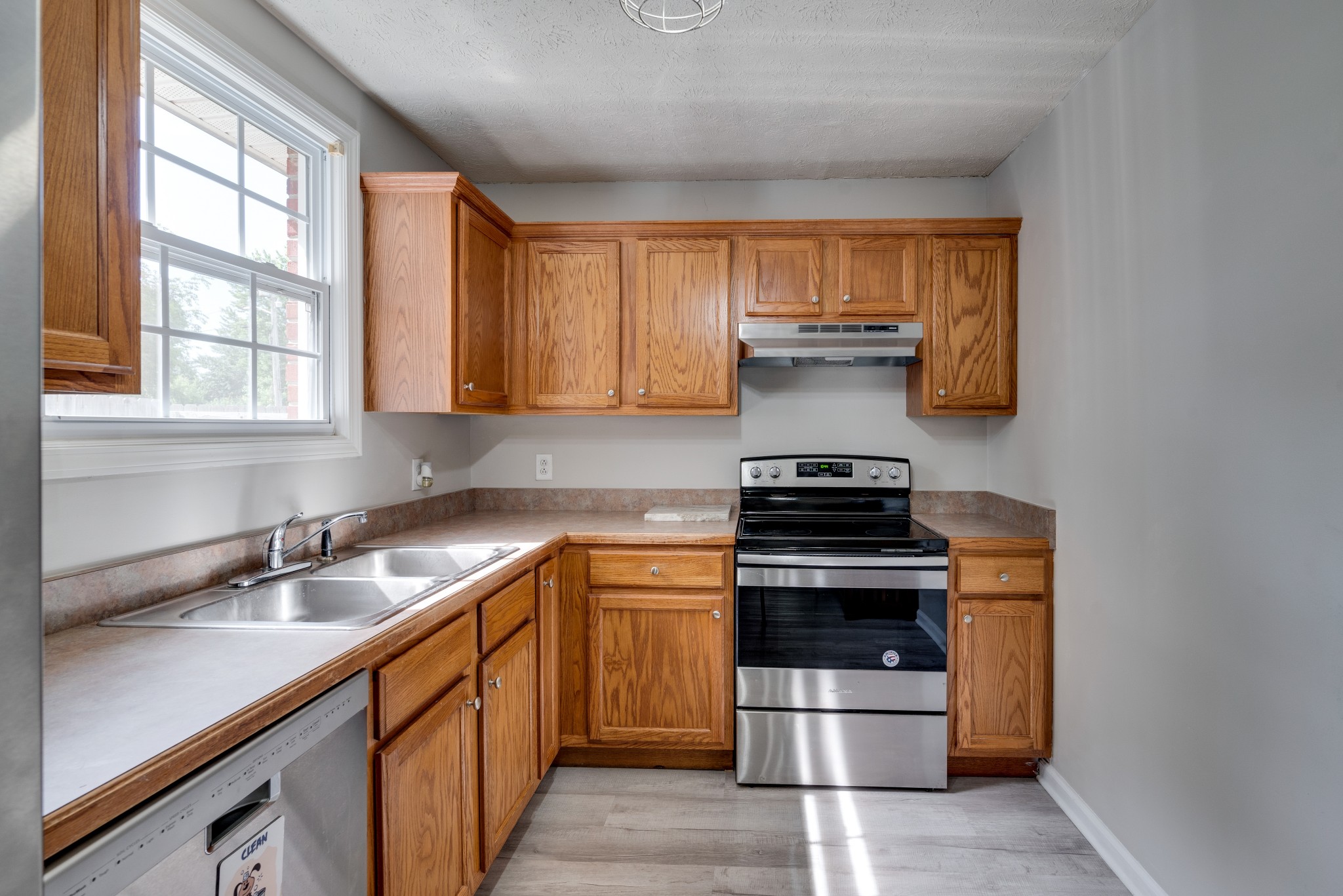211 Westwind Drive Springfield, TN 37172 - Photo 12 of 33 a kitchen with a stove and a sink