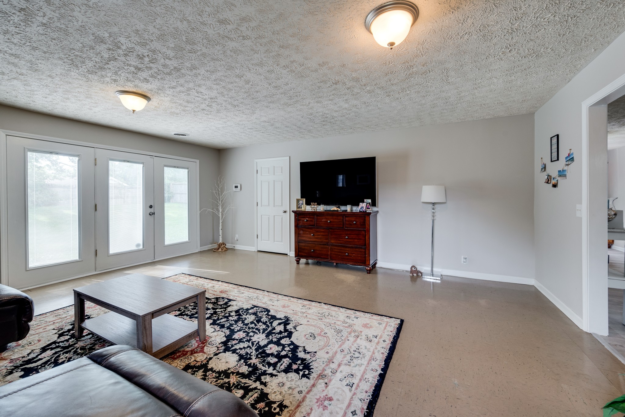 211 Westwind Drive Springfield, TN 37172 - Photo 16 of 33 a living room with furniture and a flat screen tv