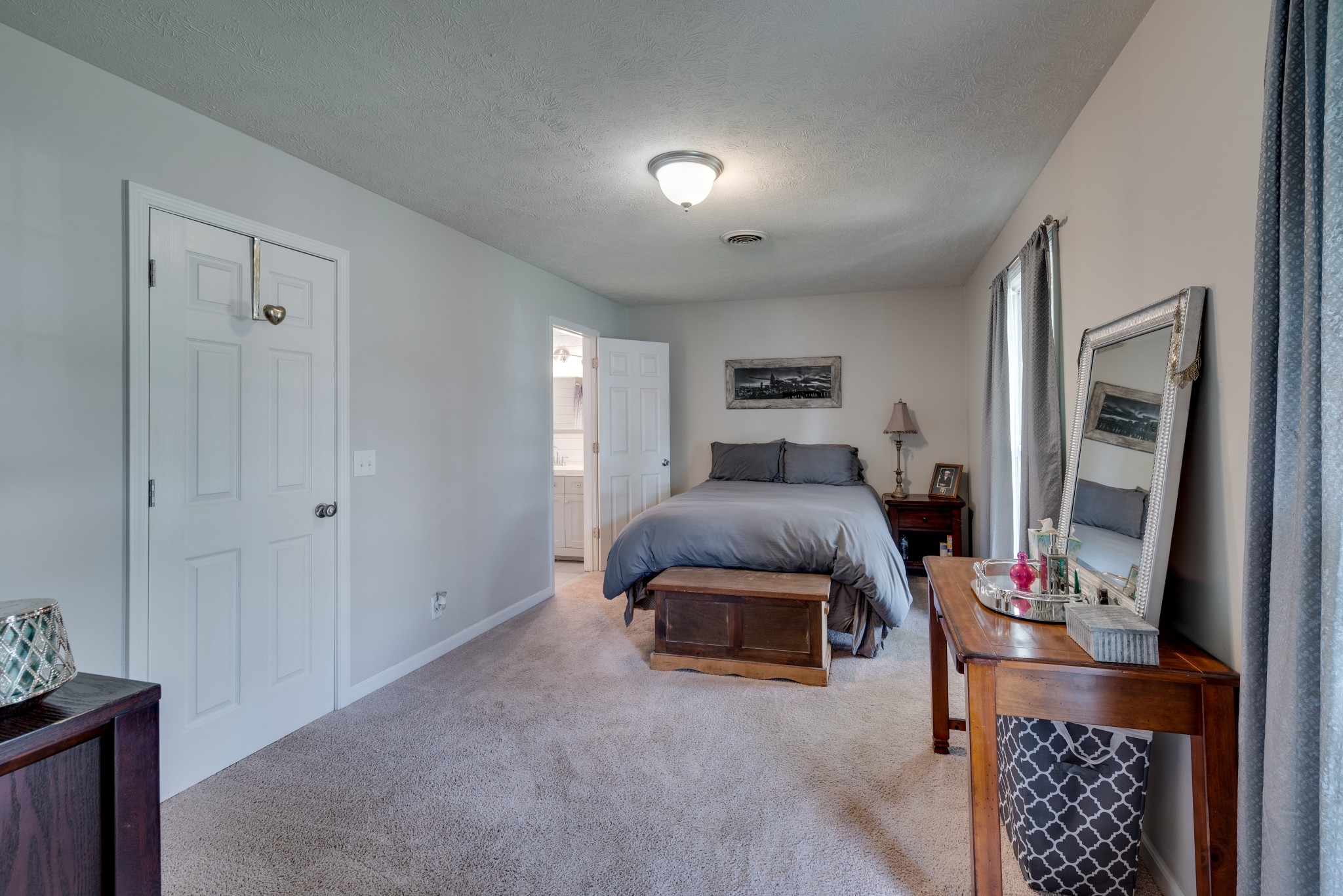 211 Westwind Drive Springfield, TN 37172 - Photo 17 of 33 a bedroom with furniture and a flat screen tv