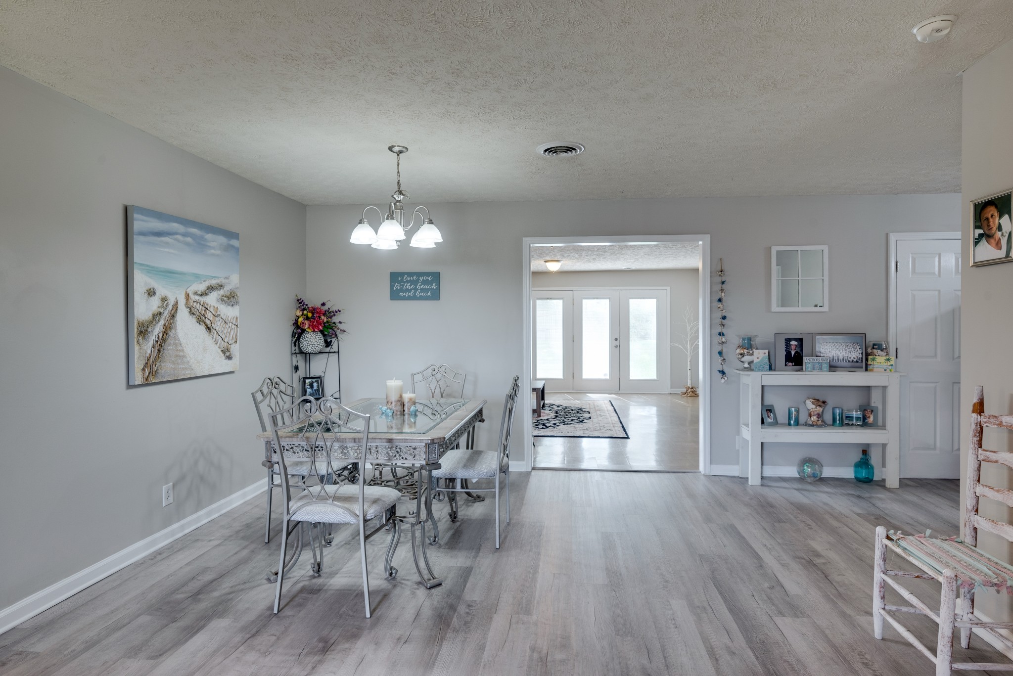 211 Westwind Drive Springfield, TN 37172 - Photo 8 of 33 a view of a dining room with furniture and wooden floor