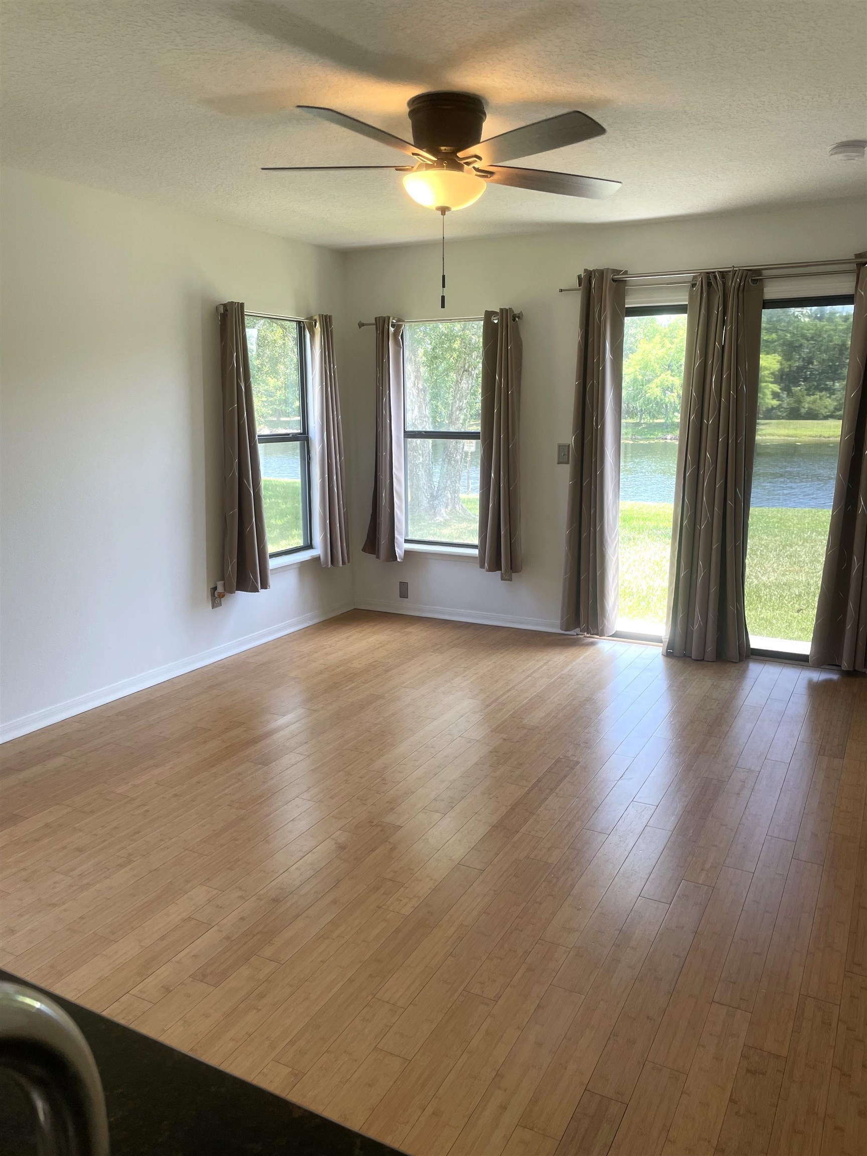 509 Cabernet Place St. Augustine, FL 32084 - Photo 3 of 16 a view of an empty room with glass door and a window