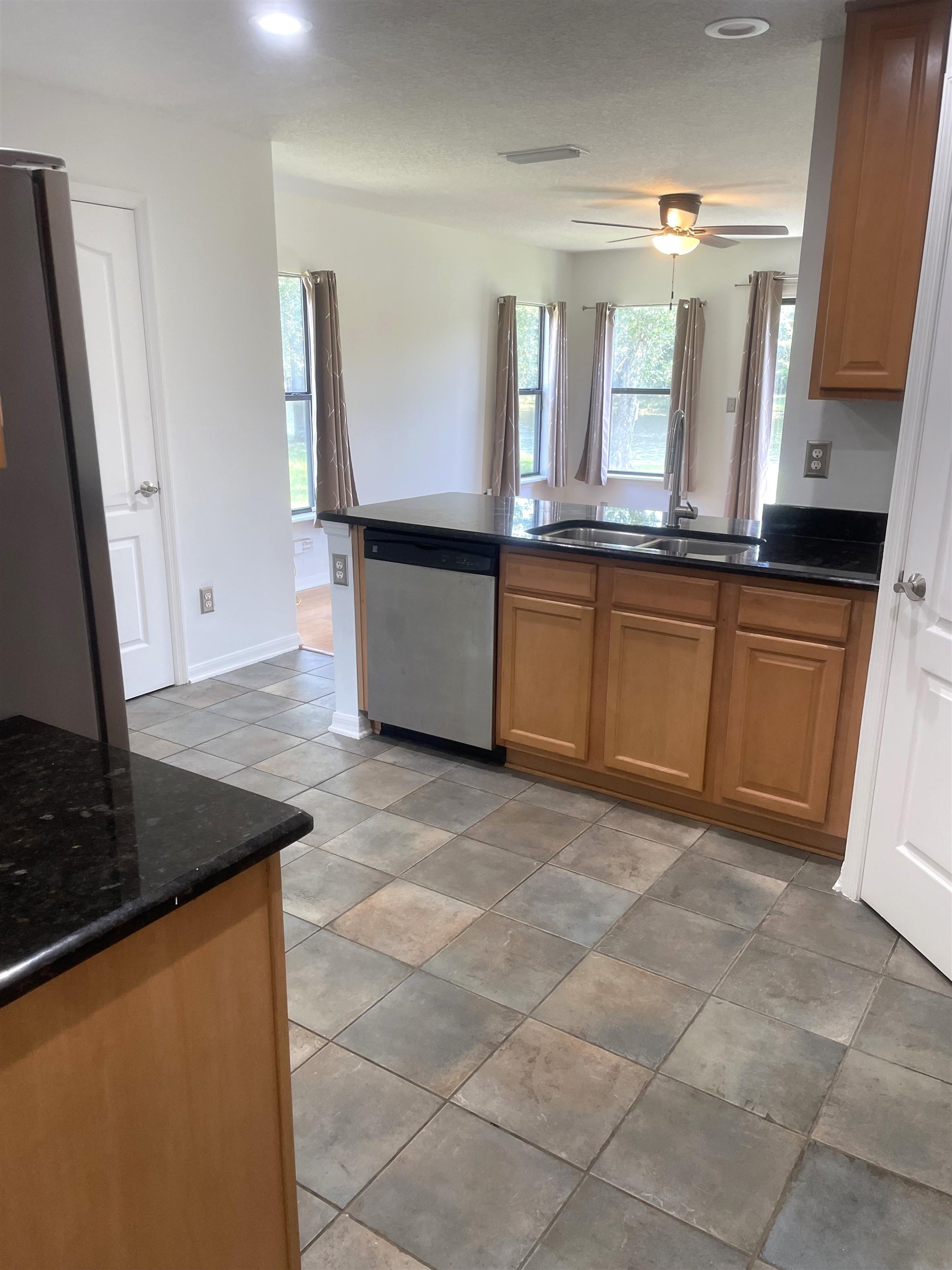 509 Cabernet Place St. Augustine, FL 32084 - Photo 5 of 16 a kitchen with granite countertop a sink and a stove