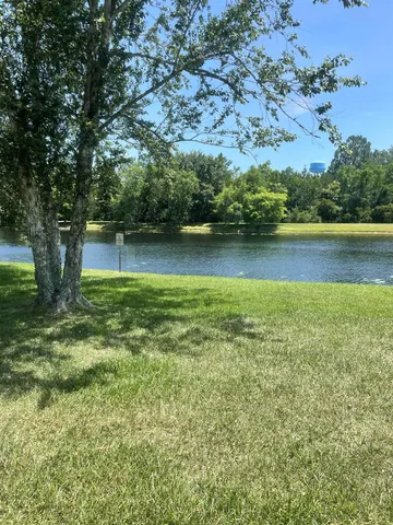 a view of a lake from a yard