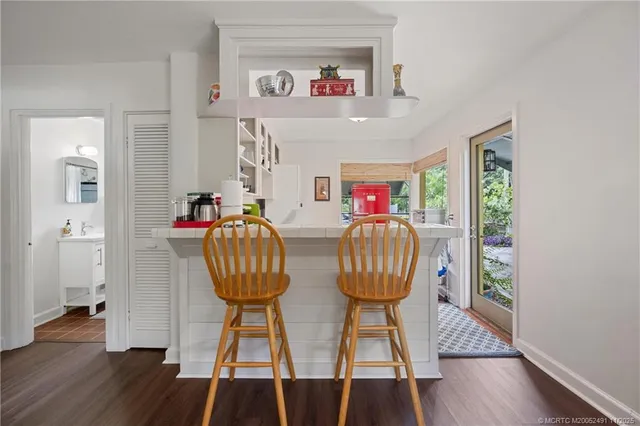 a utility room with cabinets washer and dryer