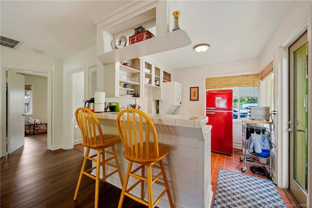 120 Southwest 5th Street Stuart, FL 34994 - Photo 12 of 35 a dining room with furniture and wooden floor