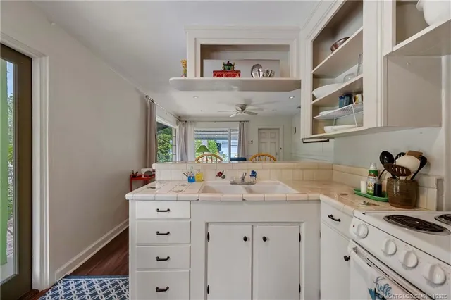 a bedroom with a large bed and a large window