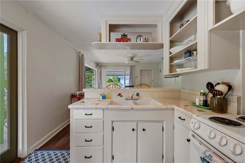 120 Southwest 5th Street Stuart, FL 34994 - Photo 15 of 35 a bathroom with a sink and a mirror