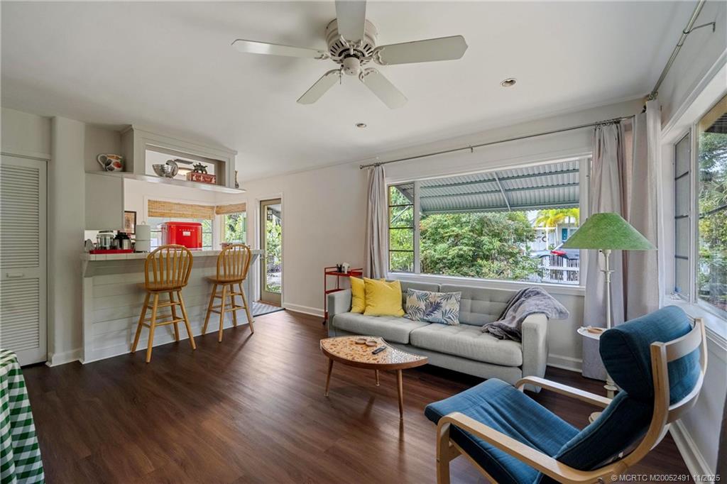 120 Southwest 5th Street Stuart, FL 34994 - Photo 7 of 35 a living room with furniture and a large window
