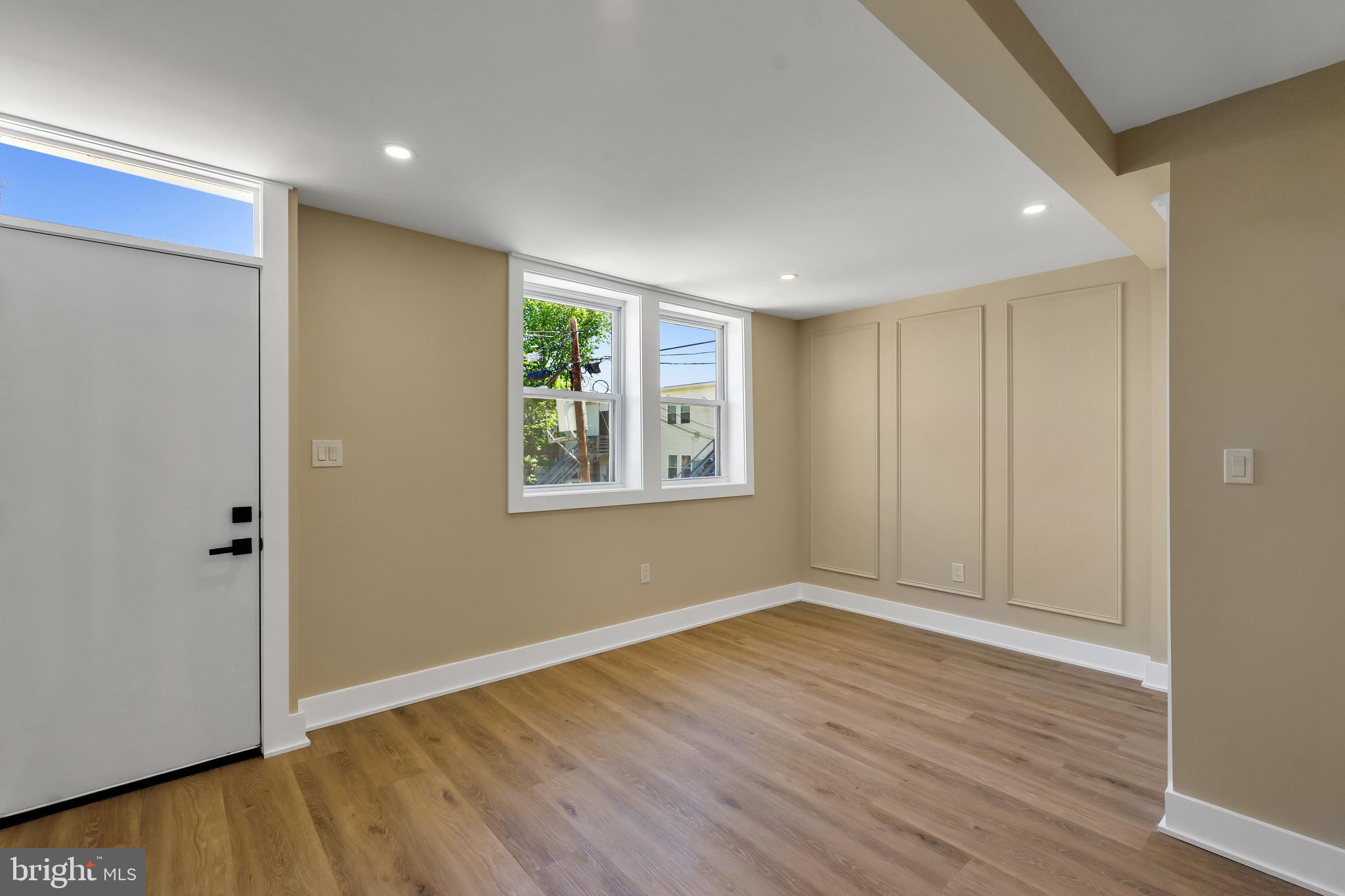 1274 Meigs Place Northeast Washington, DC 20002 - Photo 14 of 57 a view of an empty room with wooden floor and a window