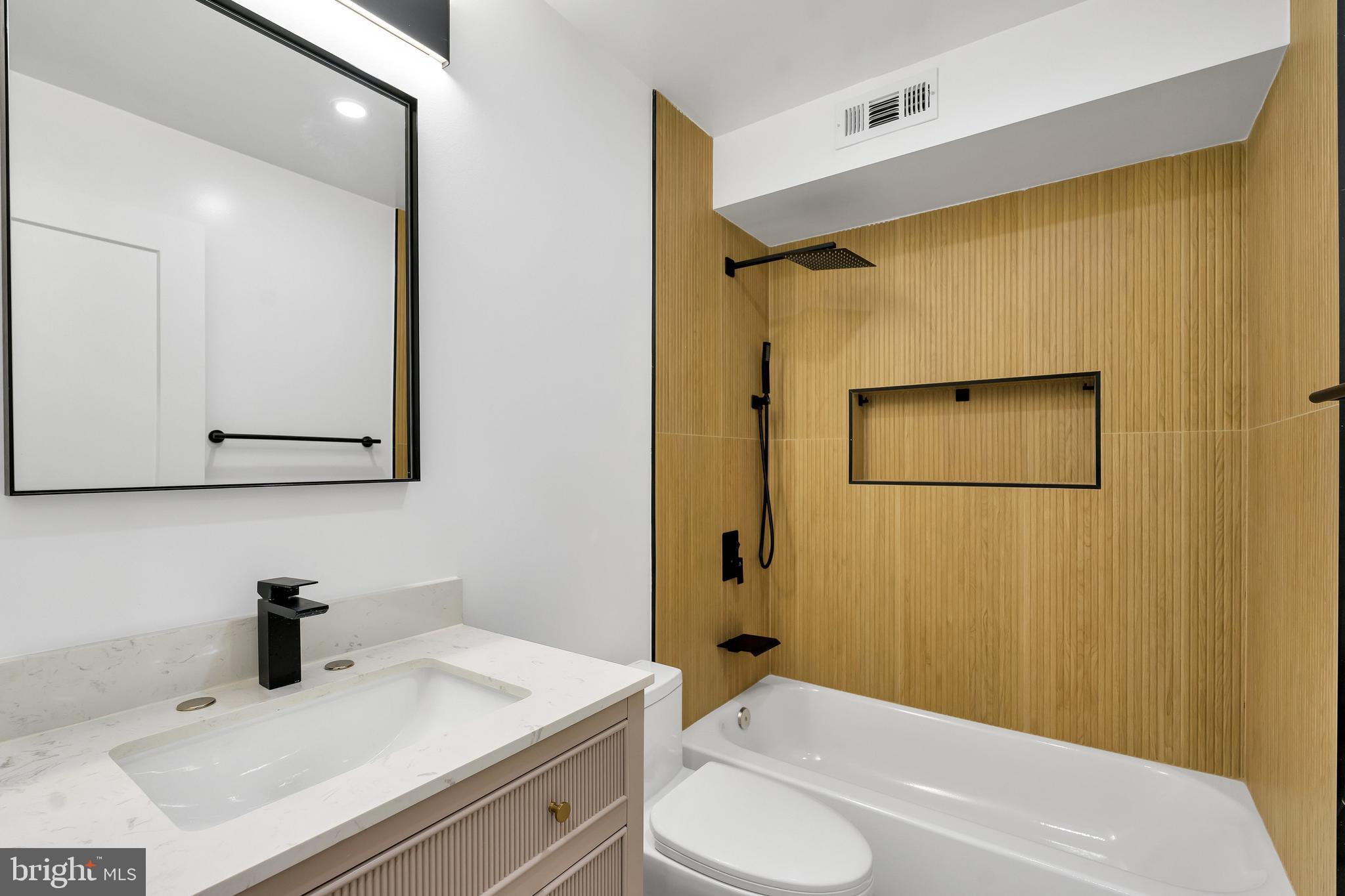 1274 Meigs Place Northeast Washington, DC 20002 - Photo 28 of 57 a bathroom with a sink and a mirror