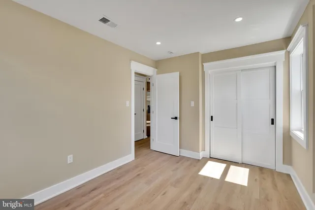 a view of a kitchen with a sink and a window