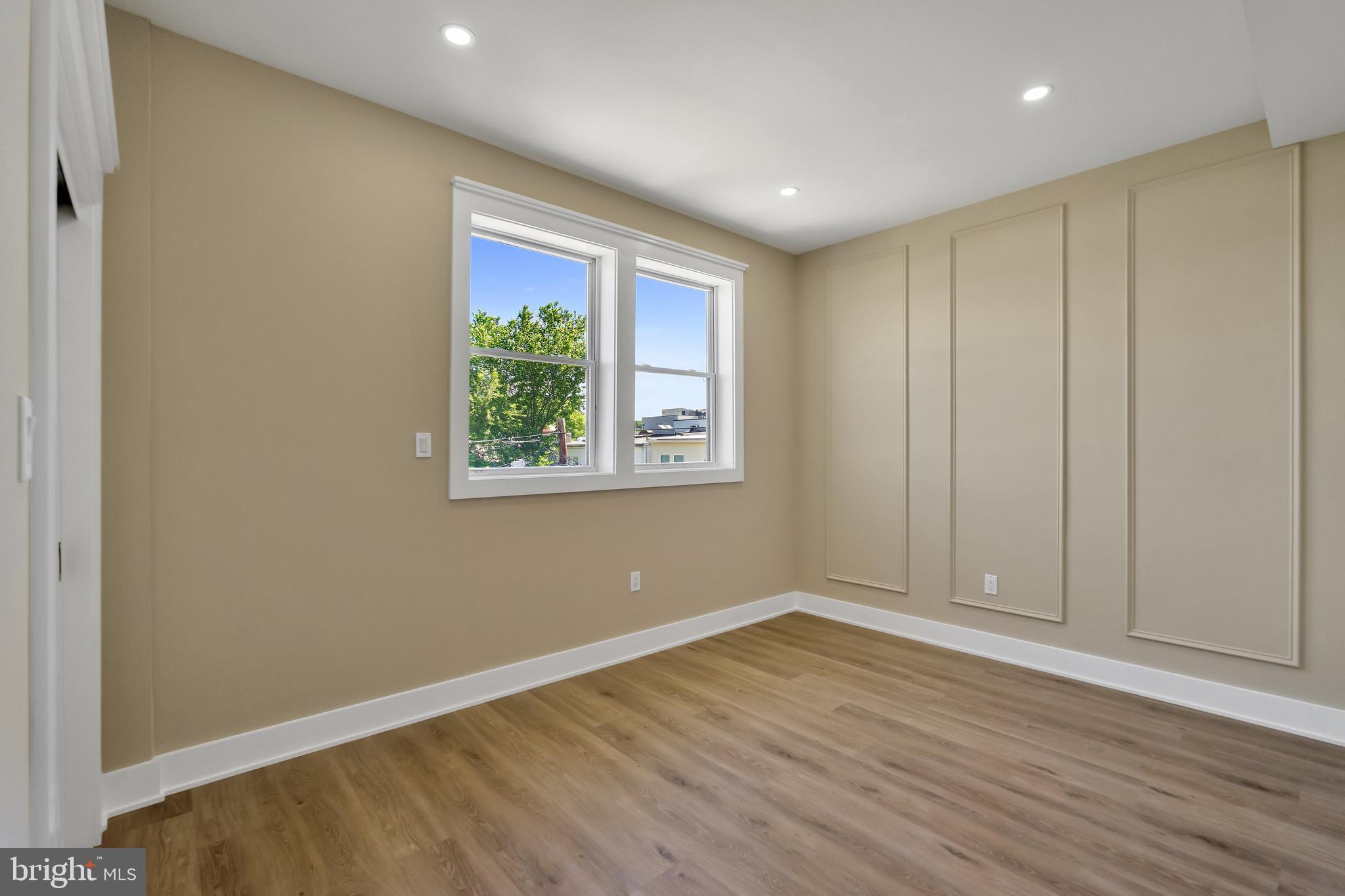 1274 Meigs Place Northeast Washington, DC 20002 - Photo 50 of 57 a view of empty room with wooden floor and fan