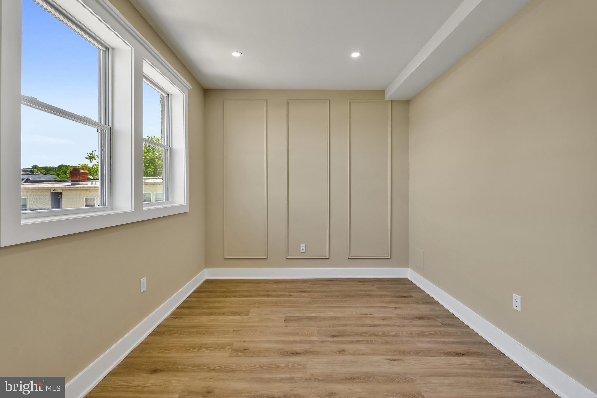 1274 Meigs Place Northeast Washington, DC 20002 - Photo 51 of 57 a view of an empty room with wooden floor and a window