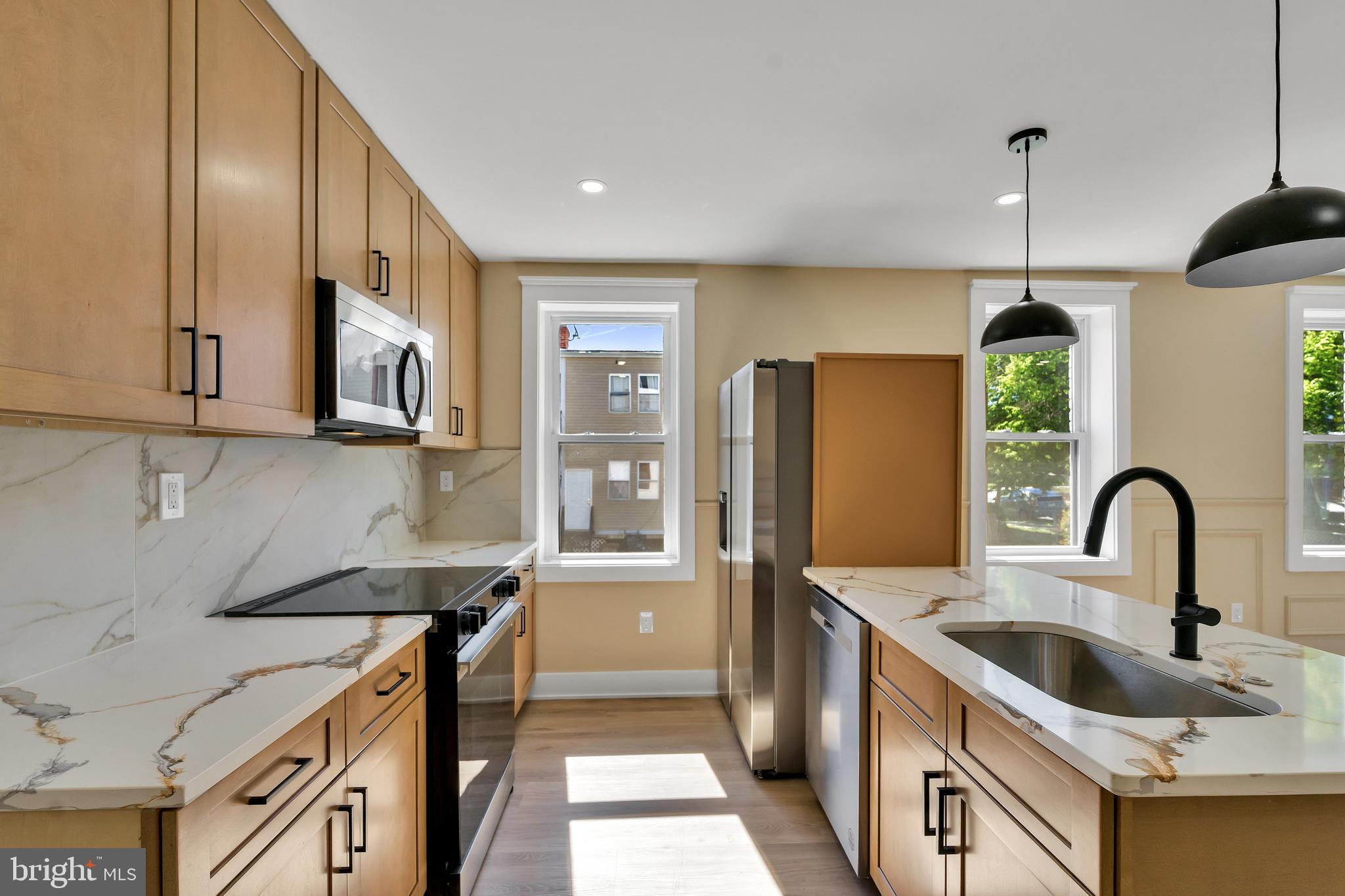 1274 Meigs Place Northeast Washington, DC 20002 - Photo 5 of 57 a kitchen with stainless steel appliances granite countertop a sink a stove and a refrigerator