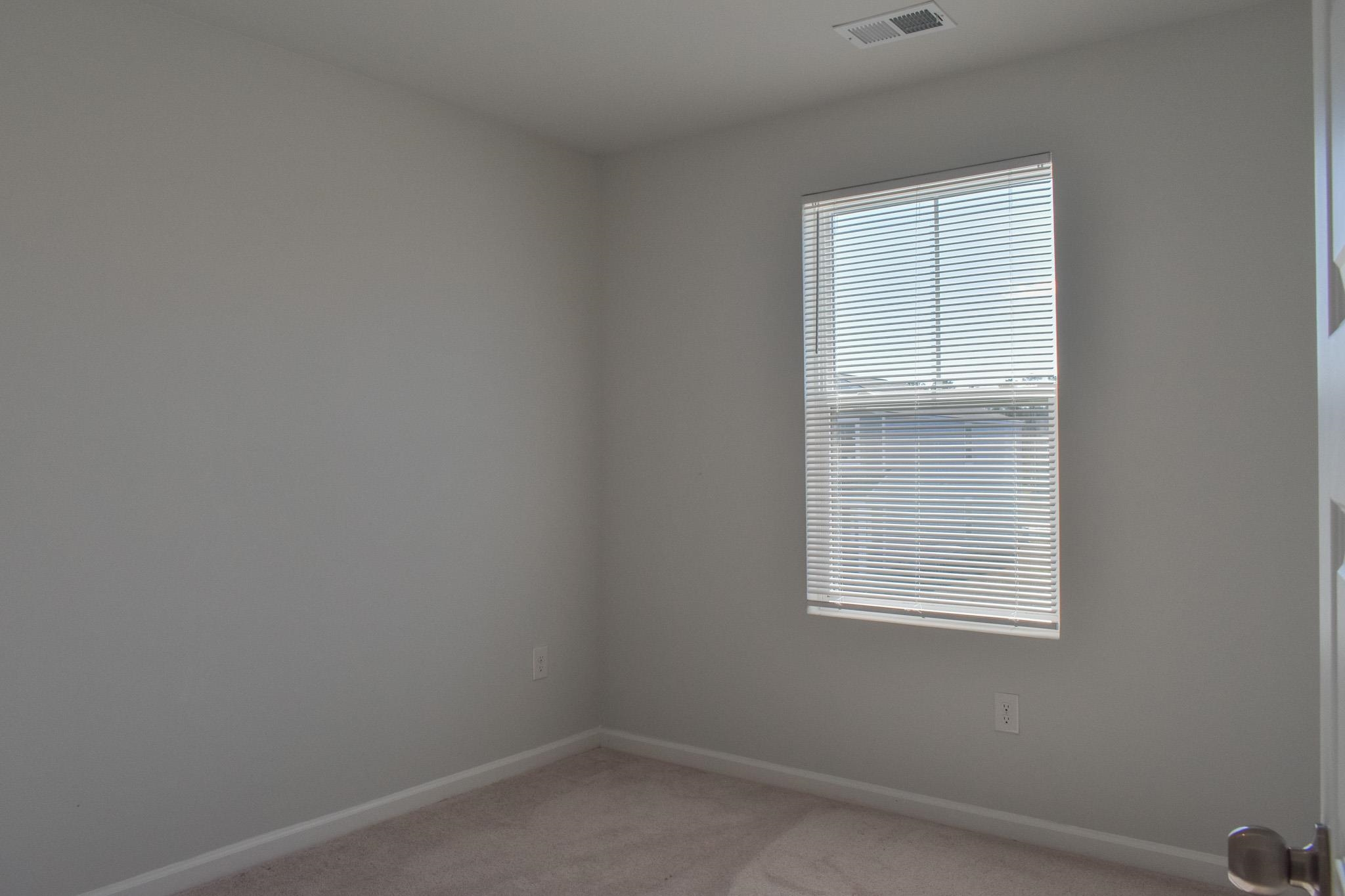 1057 Saltgrass Way Myrtle Beach, SC 29588 - Photo 12 of 23 Unfurnished room featuring baseboards and light carpet