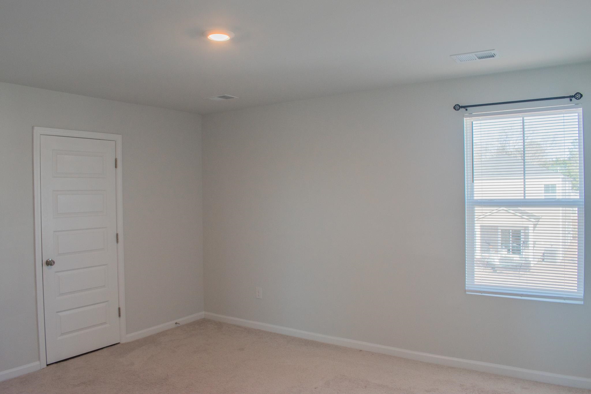 1057 Saltgrass Way Myrtle Beach, SC 29588 - Photo 17 of 23 Spare room with baseboards and light carpet