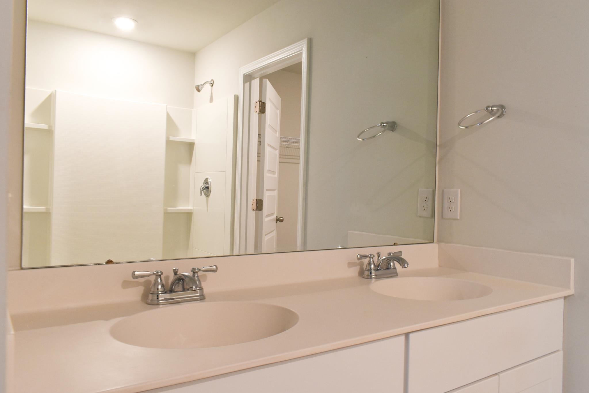 1057 Saltgrass Way Myrtle Beach, SC 29588 - Photo 19 of 23 Full bathroom featuring double vanity and a shower