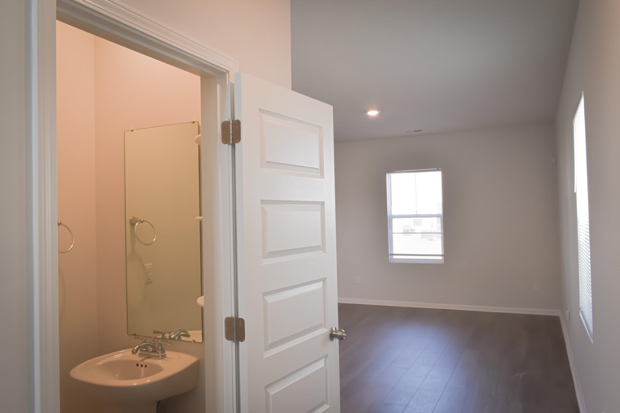 1057 Saltgrass Way Myrtle Beach, SC 29588 - Photo 21 of 23 Bathroom with recessed lighting and dark wood-style flooring