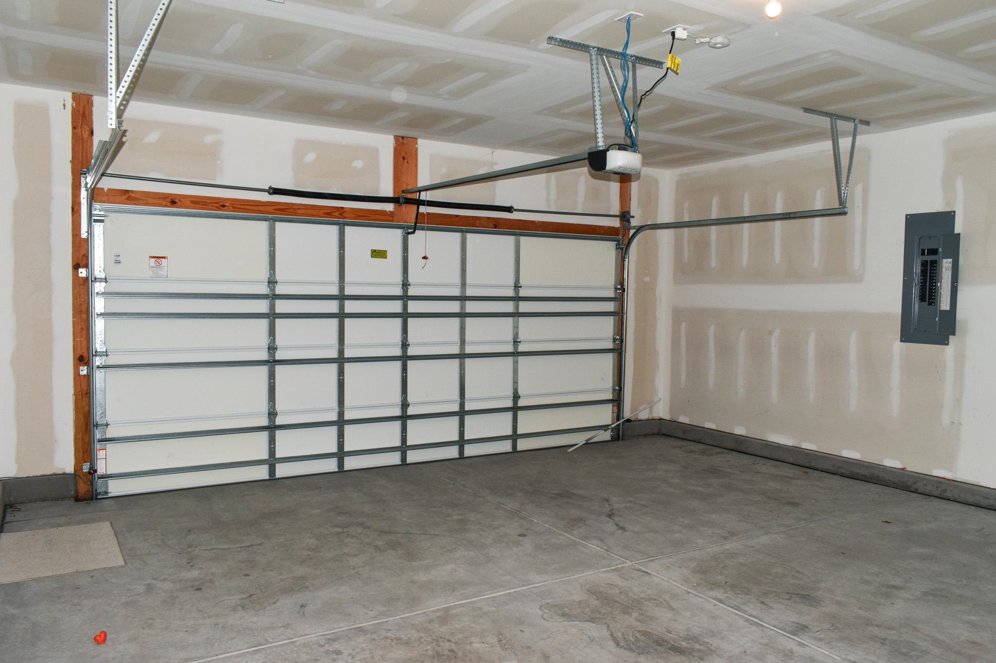 1057 Saltgrass Way Myrtle Beach, SC 29588 - Photo 22 of 23 Garage with electric panel and a garage door opener