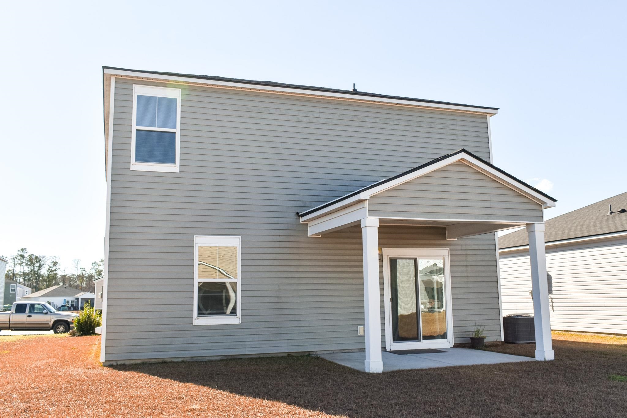1057 Saltgrass Way Myrtle Beach, SC 29588 - Photo 23 of 23 Rear view of house featuring a patio