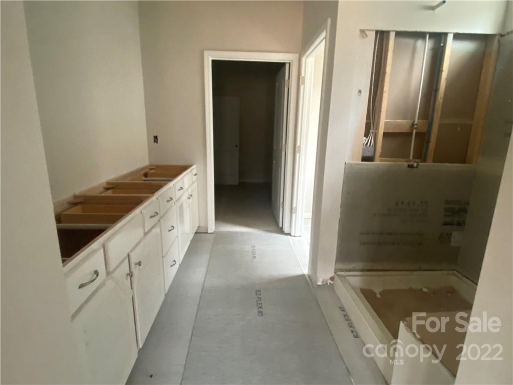 3237 Windhaven Lane, Unit 98 Tega Cay, SC 29708 - Photo 11 of 17 a bathroom with granite countertop shower and a sink