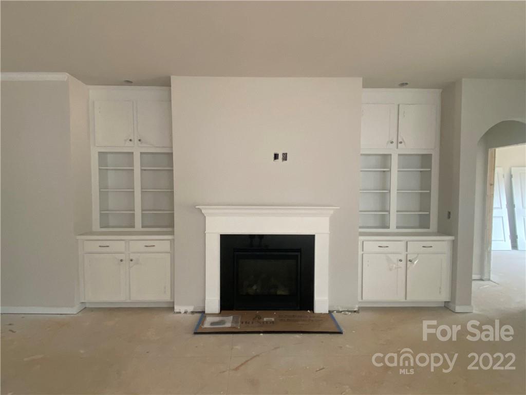 3237 Windhaven Lane, Unit 98 Tega Cay, SC 29708 - Photo 5 of 17 a living room with furniture and a fireplace