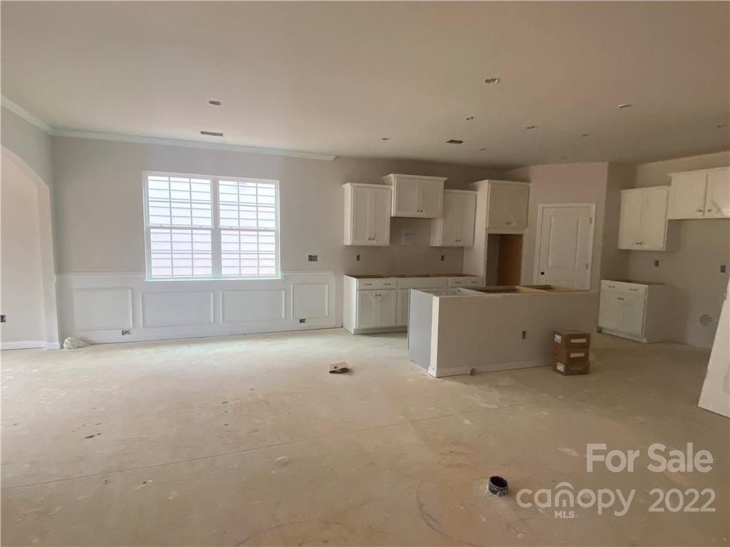 3237 Windhaven Lane, Unit 98 Tega Cay, SC 29708 - Photo 8 of 17 a view of a kitchen with a sink cabinets and a window