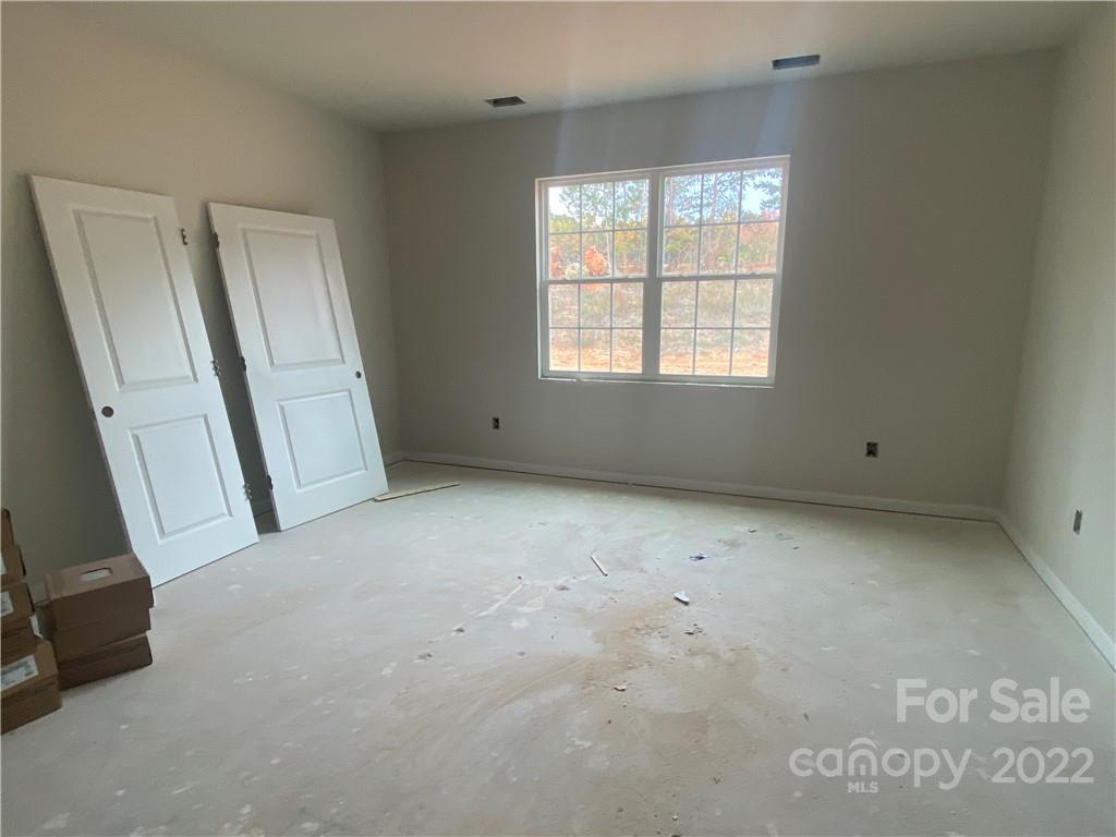 3237 Windhaven Lane, Unit 98 Tega Cay, SC 29708 - Photo 10 of 17 an empty room with windows