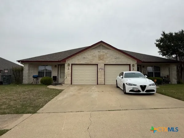 a car parked in front of a house