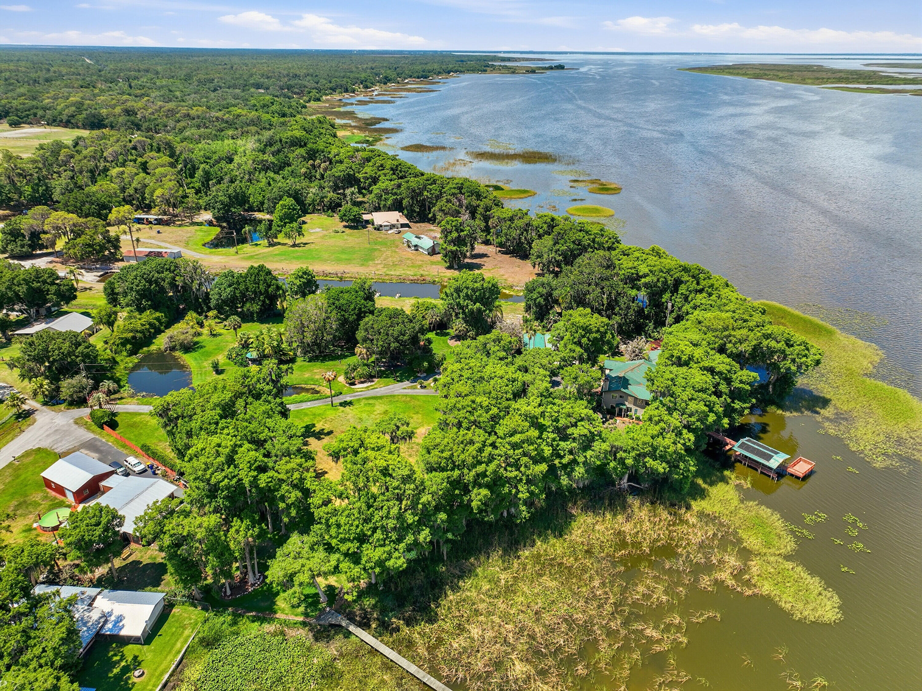 200 Windy Point Road Lake Placid, FL 33852 - Photo 69 of 74 a view of a lake with a yard