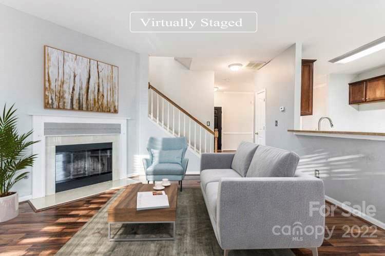 11333 Chapeclane Road Charlotte, NC 28278 - Photo 2 of 23 a living room with furniture and a fireplace