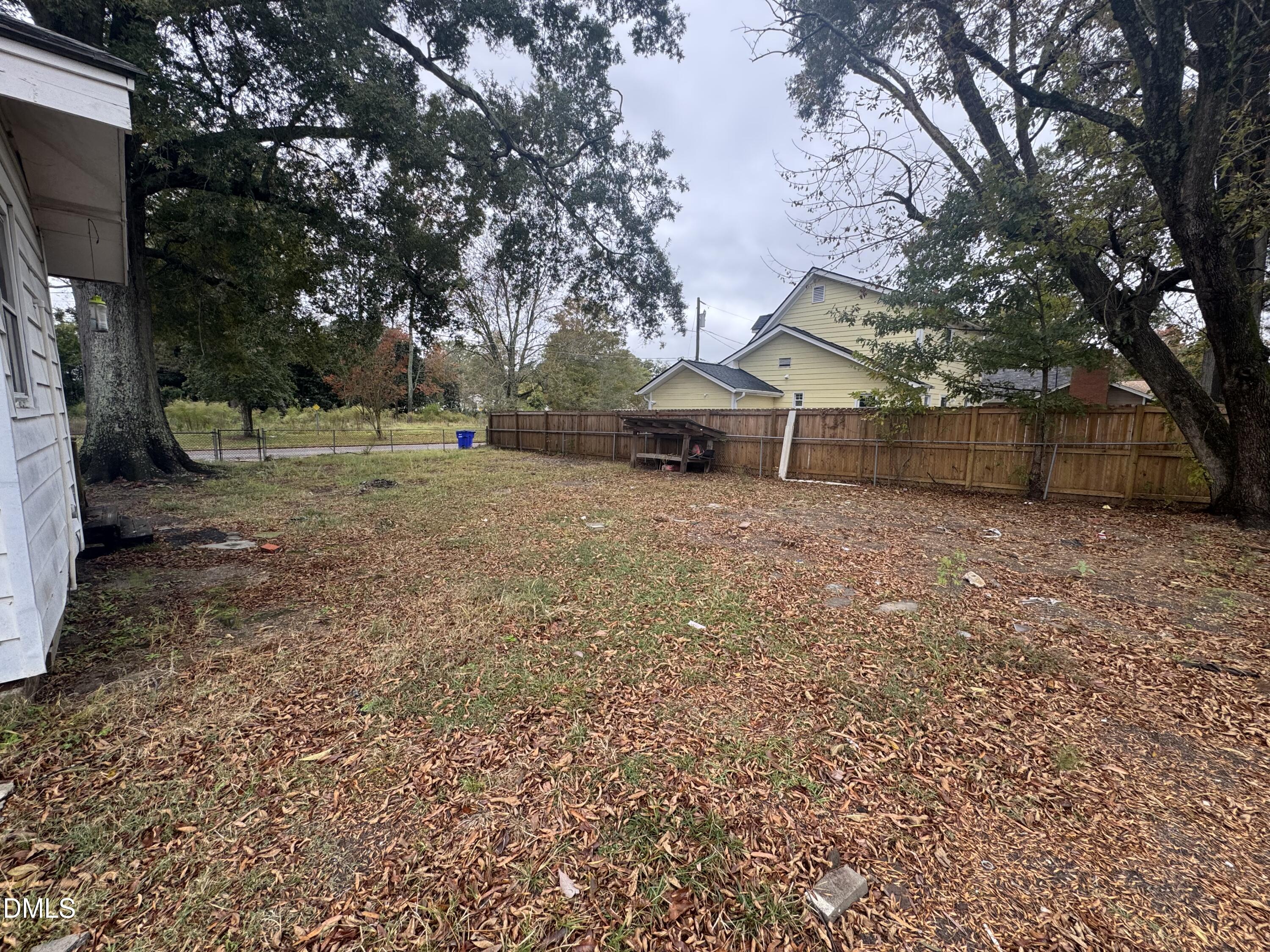 212 South 6th Street Smithfield, NC 27577 - Photo 15 of 17 a view of a yard with a tree