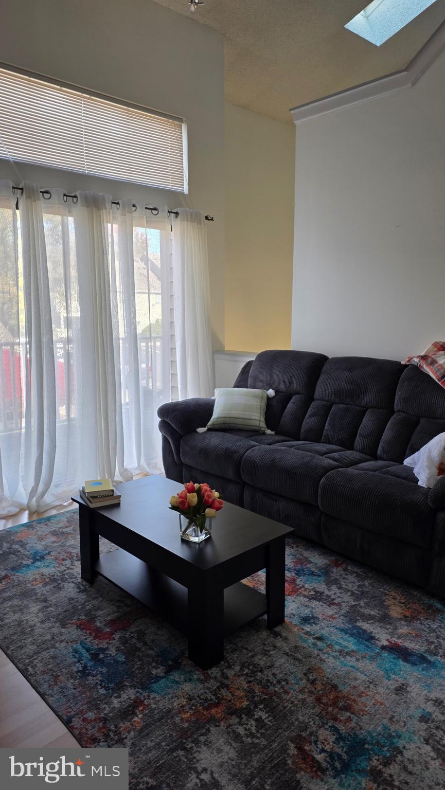 1212 Roberts Way Voorhees, NJ 08043 - Photo 11 of 29 a living room with furniture and a rug
