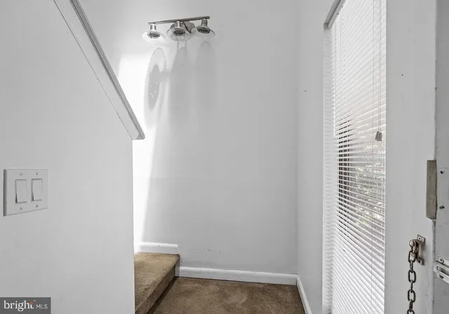 a view of a hallway with windows