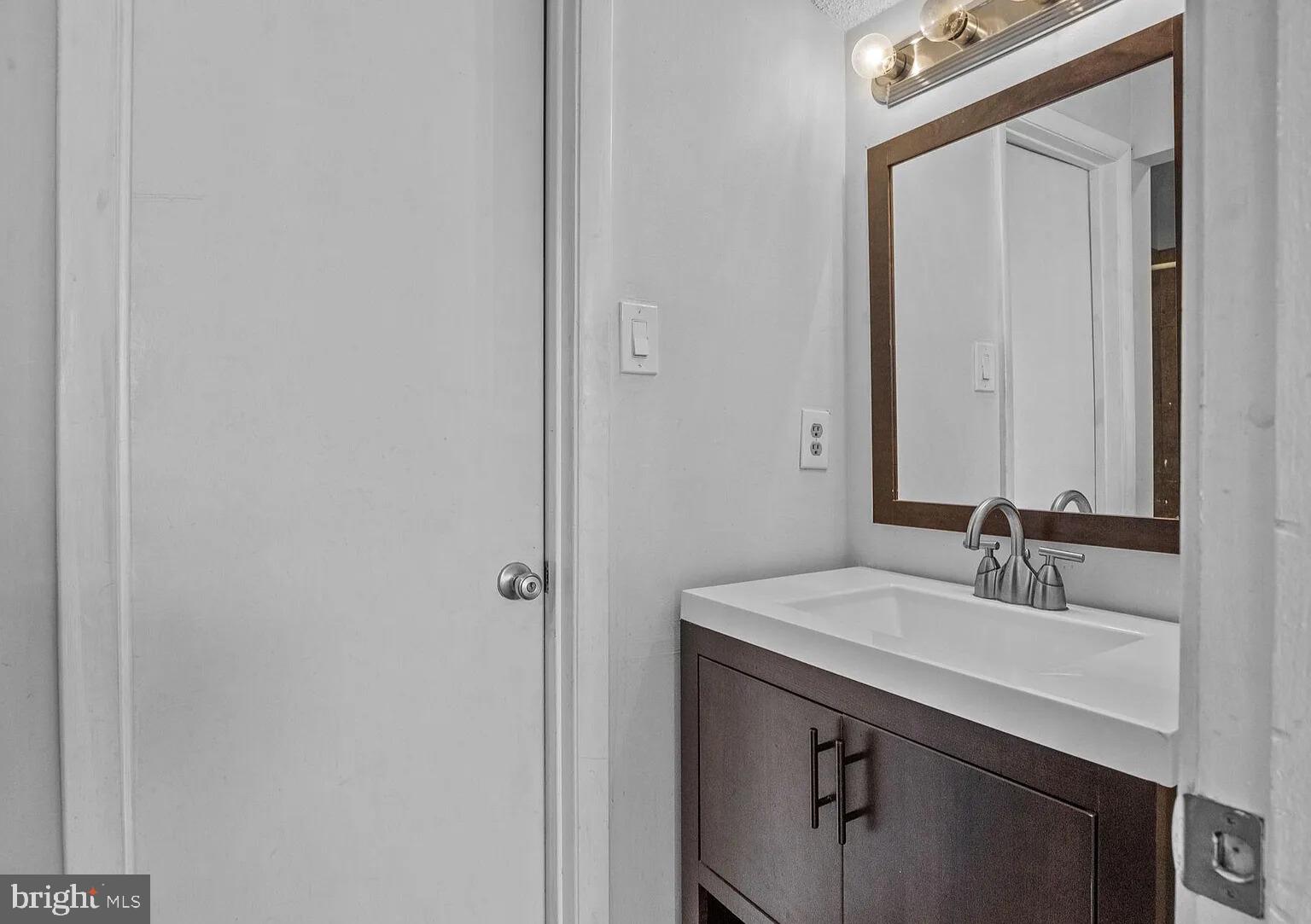 1212 Roberts Way Voorhees, NJ 08043 - Photo 25 of 29 a bathroom with a sink and a mirror