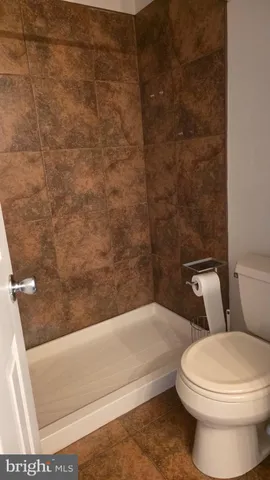 a view of a chair and table in the balcony