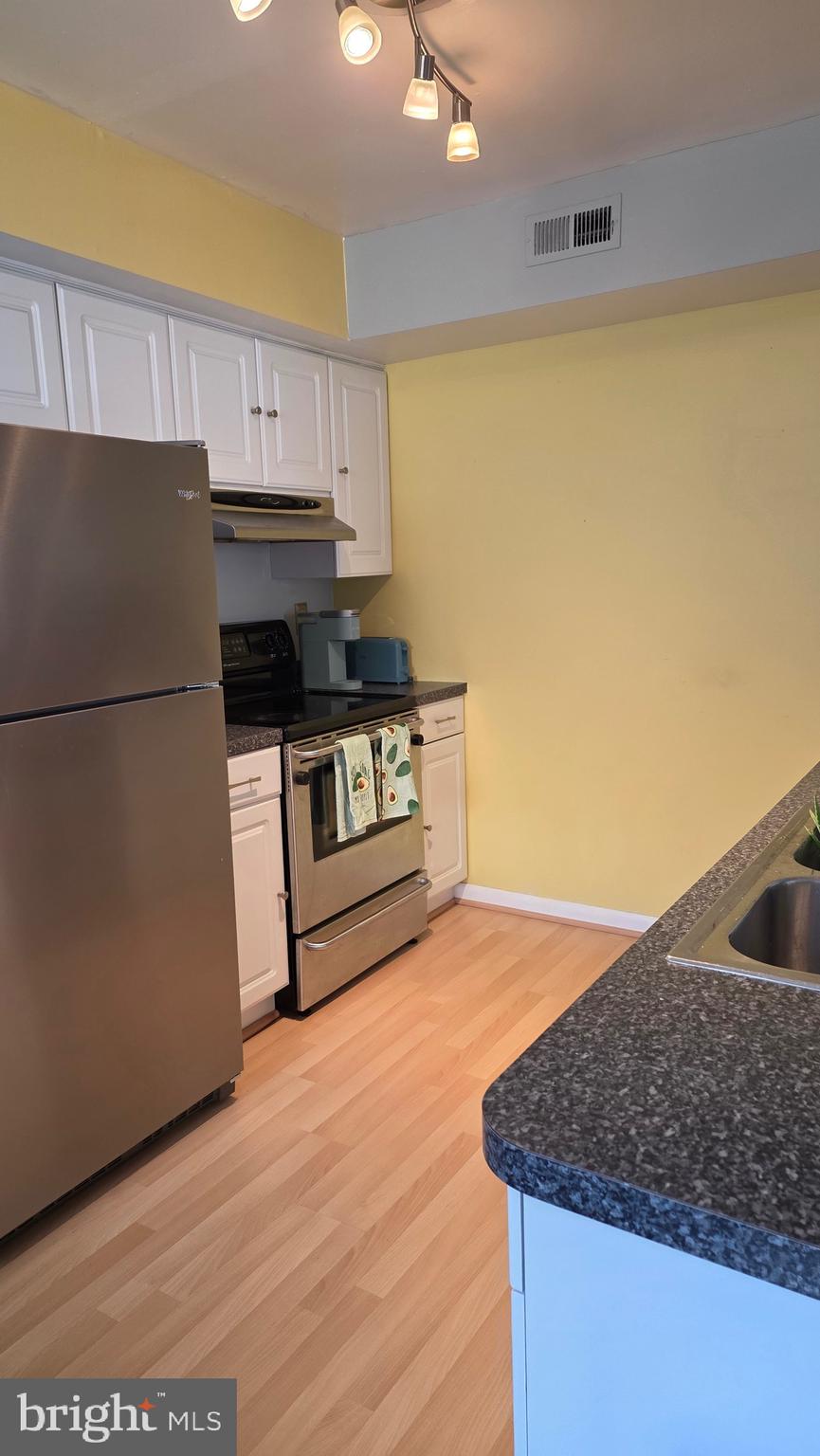 1212 Roberts Way Voorhees, NJ 08043 - Photo 3 of 29 a kitchen with a sink a stove and a refrigerator