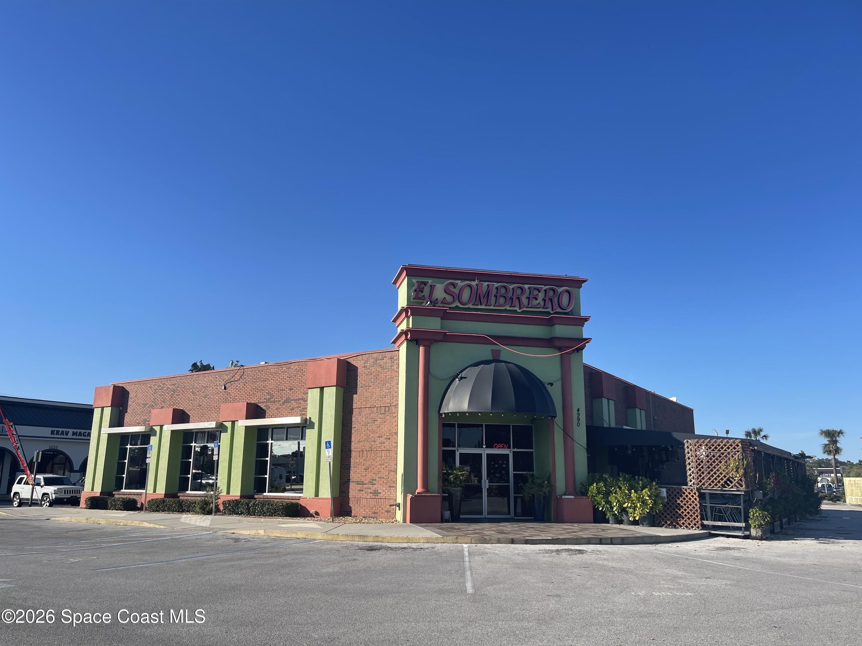 a view of a building with a street