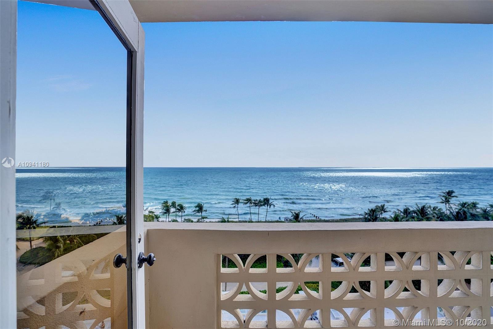 10185 Collins Avenue, Unit 818 Bal Harbour, FL 33154 - Photo 2 of 41 a view of a lake from a balcony