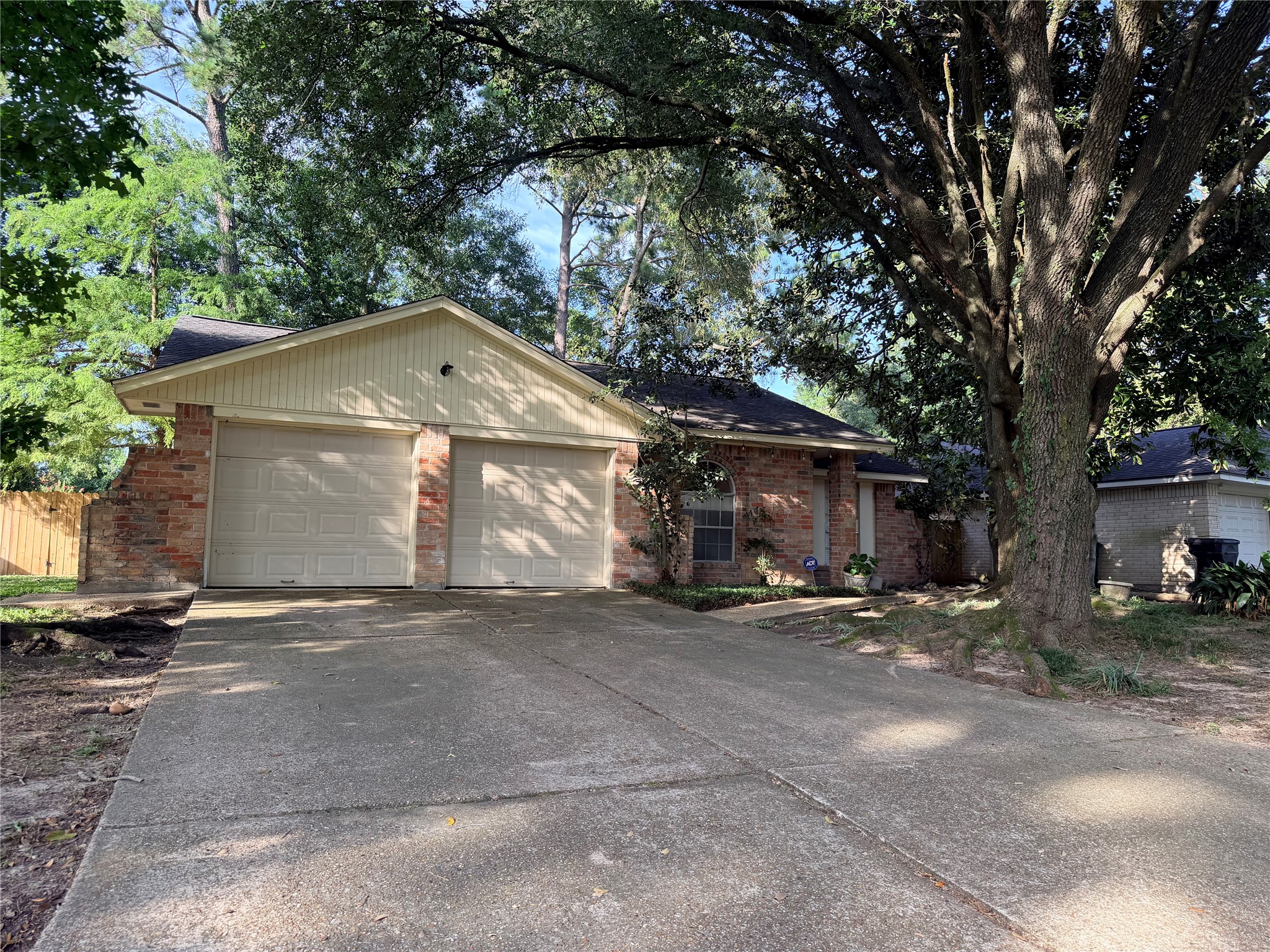 2439 Meandering Trail Houston, TX 77339 - Photo 1 of 8 a front view of a house with a yard and garage