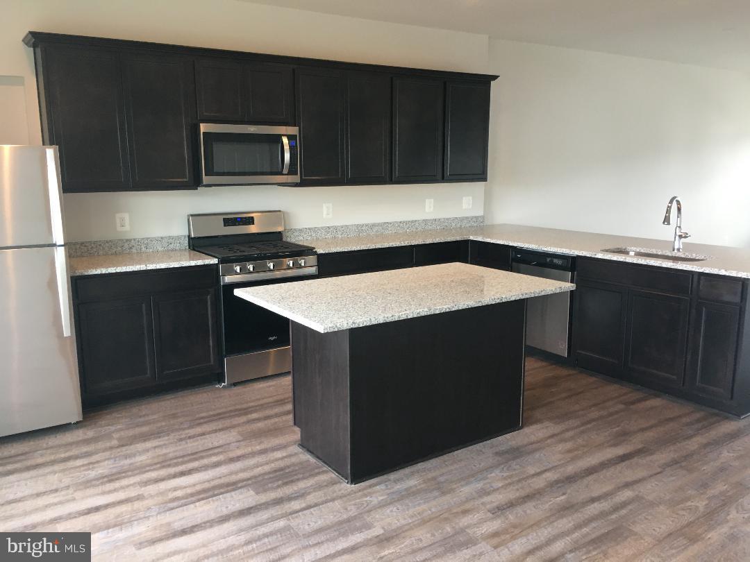 145 Jewel Stephenson, VA 22656 - Photo 3 of 15 a kitchen with a sink and a stove top oven