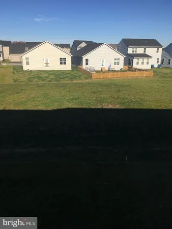 a view of a big yard with an outdoor space