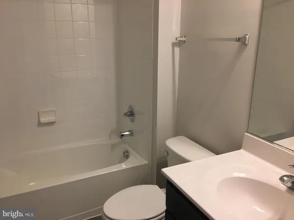 a bathroom with a sink toilet and bathtub