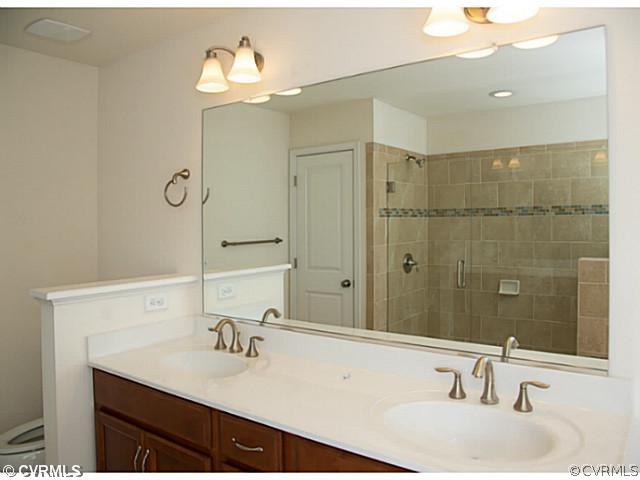26 Miners Trail Road Midlothian, VA 23114 - Photo 15 of 24 a bathroom with a sink and a mirror